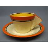 Clarice Cliff conical cup and saucer with triangular infilled handle with a striped design