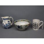 20th century printed mug with an armorial, together with a further Wedgwood willow pattern jug and a