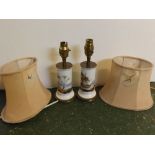 Pair of cylindrical ship painted electric lamps with brass cap and cylindrical base, puce shades,