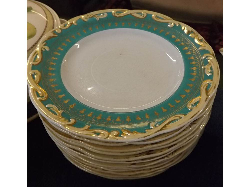 Quantity of 12 dinner plates with raised relief to borders with gilded detail, 9ins diam