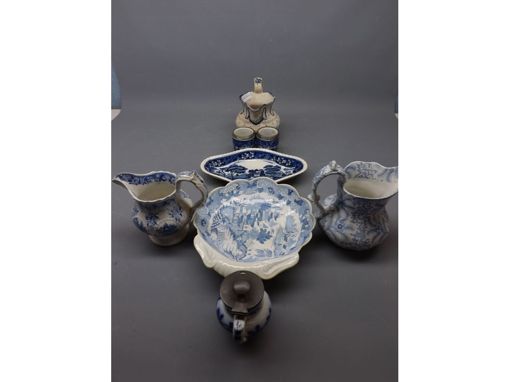 Two 19th century blue and white jugs together with a further pewter lidded preserve pot, two