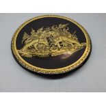 Modern paper m ch circular plate with gilded detail of Eastern figures on elephants in battle, 12ins