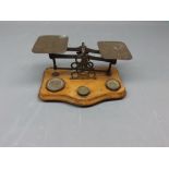 Pair of brass postal scales and part set of weights