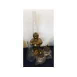 Victorian brass oil lamp together with two further squat oil lamps with ribbed decoration and