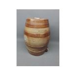 Stoneware barrel of ribbed form, 10 1/2 ins tall
