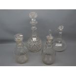 Group of four 19th/20th century clear glass decanters to include two three-ringed mallet formed