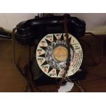 Black Bakelite telephone, model no 332F with a Keystone advertising plastic surround