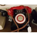 Vintage Bakelite priority calls telephone, Type 328, with a black Bakelite case and a red receiver