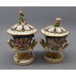 Pair of Derby pot pourri vases and covers, the blue ground with applied floral decoration, the