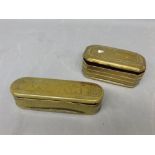 Two 18th century brass snuff boxes, one of curved rectangular form and lid decorated with a scene of