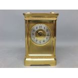 Brass four-glass carriage clock with silvered dial and brass frame