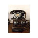 Black Bakelite pyramid telephone with black and white enamelled dialling ring, together with