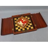 Vintage mahogany framed folding miniature chess board with a quantity of stained ivory miniature