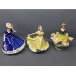 Three Royal Doulton figures to include Figure of the Year 'Mary', model HN3375, together with '