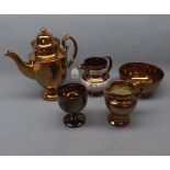 Group of 19th century copper lustre wares comprising an urn shaped teapot, circular bowl, goblet,