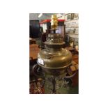 19th century adjustable oil lamp with decorative twisted metal cast column, copper leaf detail,
