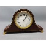 Small Edwardian mahogany cased mantel clock with enamelled dial raised on four feet, 5 1/2 ins tall