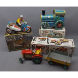 Three boxed tin plate toys comprising of motorcycle with side car, steam engine and tractor