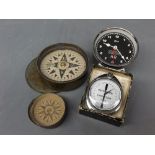 Mixed Lot: two varying sized brass lidded circular compasses, together with a Metro Dome Cadenzia
