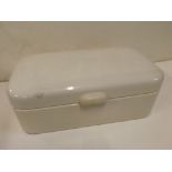 German enamel lidded bread bin with Bakelite handle, together with assorted enamel and glass door