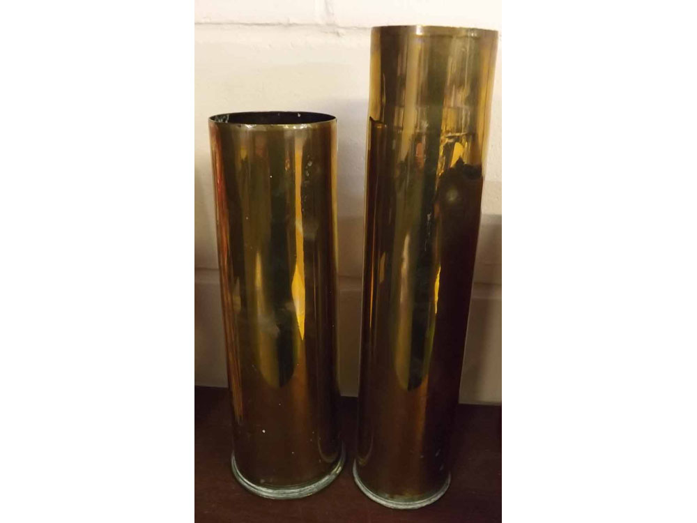 Two vintage brass shell cases