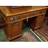 Arts & Crafts period desk, one drawer stamped "Phillips Bristol", fitted with three frieze drawers