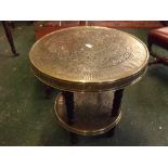 Unusual brass mounted two-tier Benares type circular table, 23 1/2 ins diam