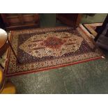 Caucasian style carpet, triple gull border, central panel of floral lozenge, mainly rust and beige/
