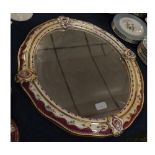 Vienna porcelain circular wall mirror with gilded and painted floral design, raised decoration