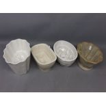 Four various vintage jelly moulds