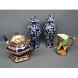 Pair of decorative Oriental style blue and white floral covered vases, together with further Royal
