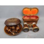 Pair of opera glasses in case and a pair of olive wood sectional candlesticks