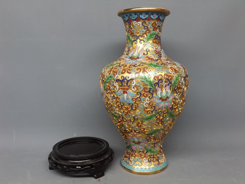 20th century cloisonne vase with raised enamel detail of flowers among scrolls, on a modern turned