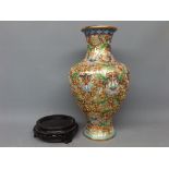 20th century cloisonne vase with raised enamel detail of flowers among scrolls, on a modern turned