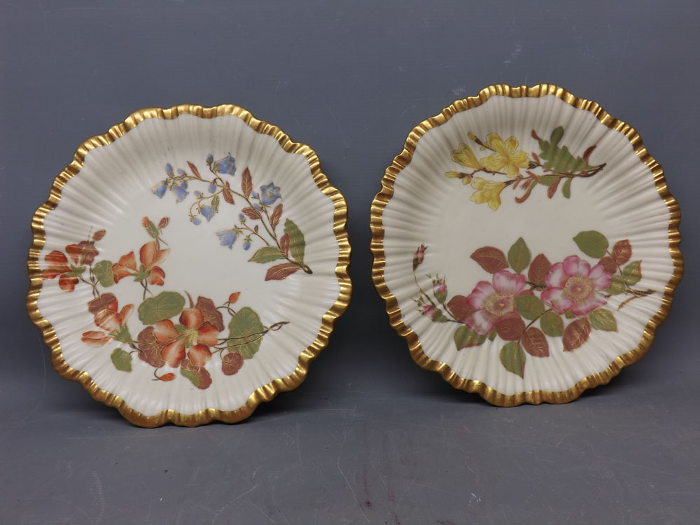 Two Royal Worcester blush plates decorated with Spring flowers, 8 1/2 ins diam