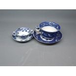 Large proportion blue and white cup and saucer with inscription and rim chips, together with a
