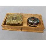 Small pressed brass storage box with lined interior, central circular plaque of a classical head