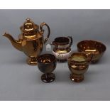 Five items of copper lustre includes bowls, jugs, coffee pot etc