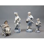 Pair of German blue and white classical figures on printed circular blue bases, together with a