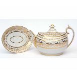 Early 19th century London shape teapot and cover with matching base decorated in gilt with a