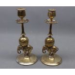 Pair of brass elephant mounted candlesticks raised on circular bases, together with drip tray, 8 1/2