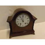 Edwardian mahogany arch top mantel clock with enamelled Arabic chapter ring, with two barley twist