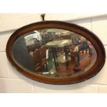 Mid-20th century oak oval wall hanging mirror with beaded edge, 27ins x 16ins