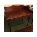 Regency mahogany single drawer side table with shaped galleried back on tapering cylindrical legs,