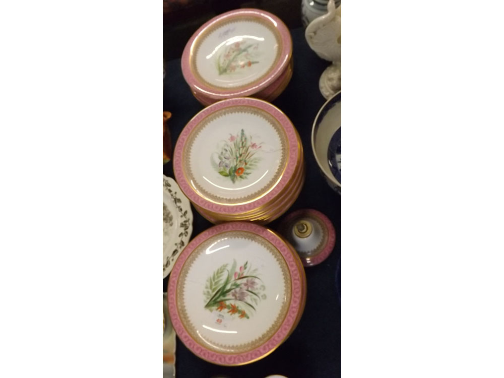 Royal Worcester part dessert service, the centres all painted with flowers within pink and gilded