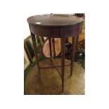 Edwardian mahogany oval side table with central inlaid lozenge and stringing throughout, raised on