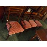 Set of eight Edwardian mahogany and satinwood inlaid dining chairs with "X" frame backs and puce