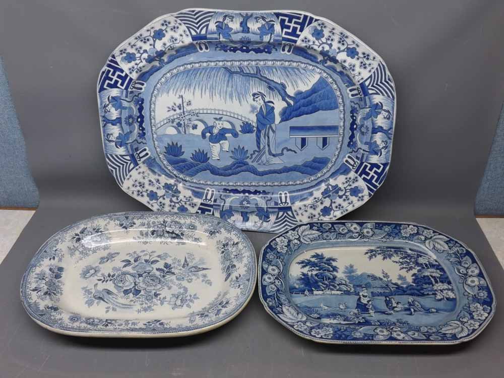 Two 19th century blue and white printed plates, one with a farmyard print, the other with a floral