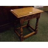 20th century oak framed joint stool with half-carved floral frieze, 17ins x 11ins x 18ins