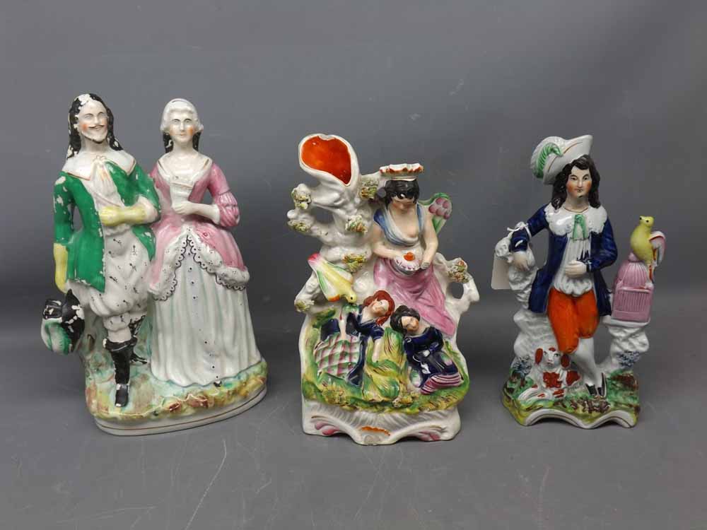 Three 19th century Staffordshire flat back groups with damage throughout, largest 10ins tall